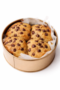 Singapore halal dubai cookie in a tin, gooey stuffed cookie tin Round container with four golden-brown baked goods on a white background
