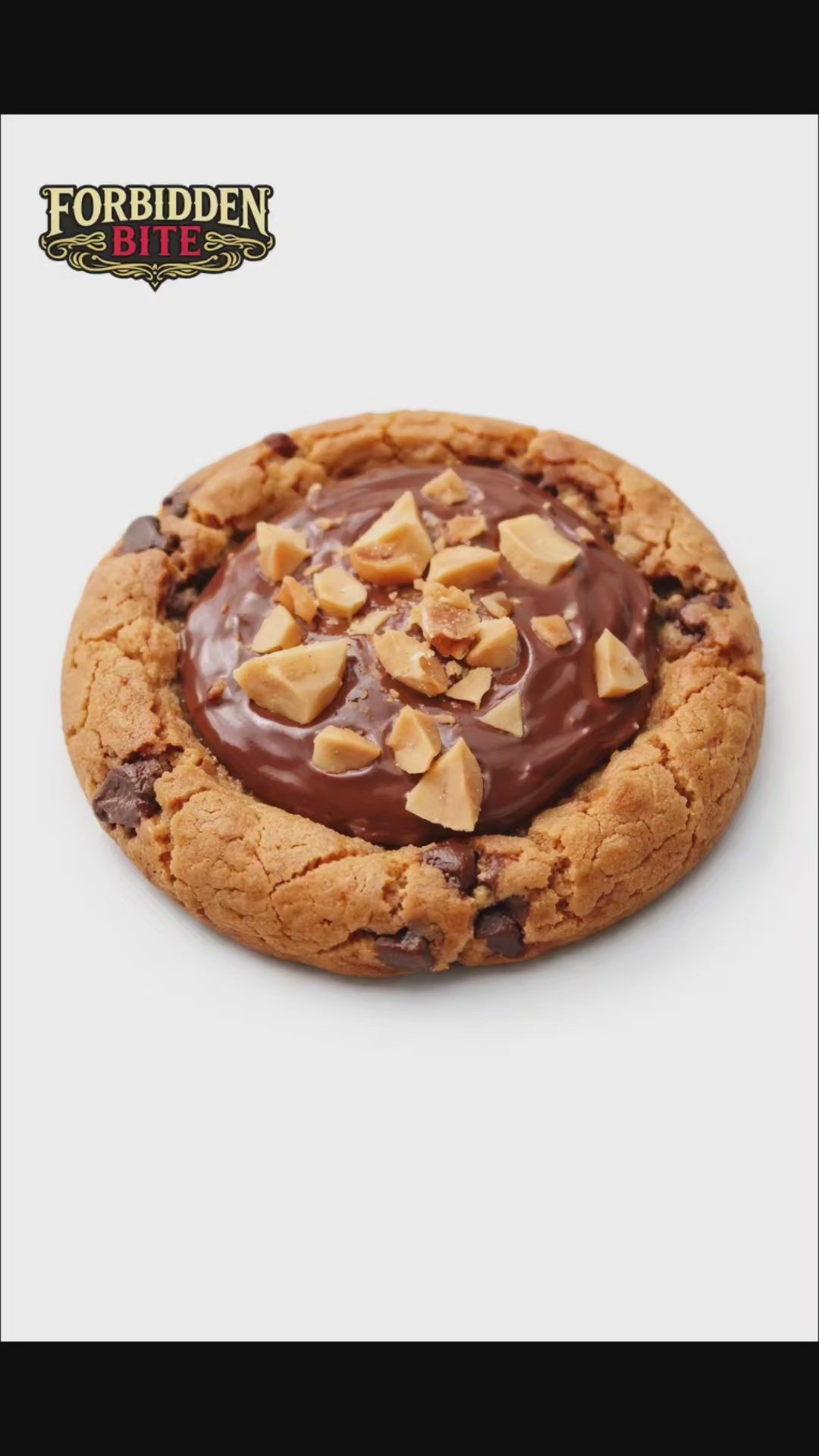 The Nutella Crown Cookie was born when we decided Nutella deserved centre stage — not hidden, not swirled, but sitting boldly in the middle like the main character it is. We baked a rich, buttery chocolate chunk cookie, pressed a crown-shaped well into it, filled it generously with smooth Nutella, then topped it with roasted hazelnut chunks because royalty needs jewels.